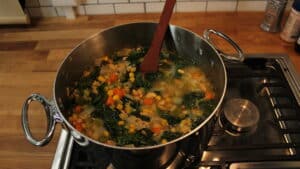 White bean and spinach soup cooking on the stove